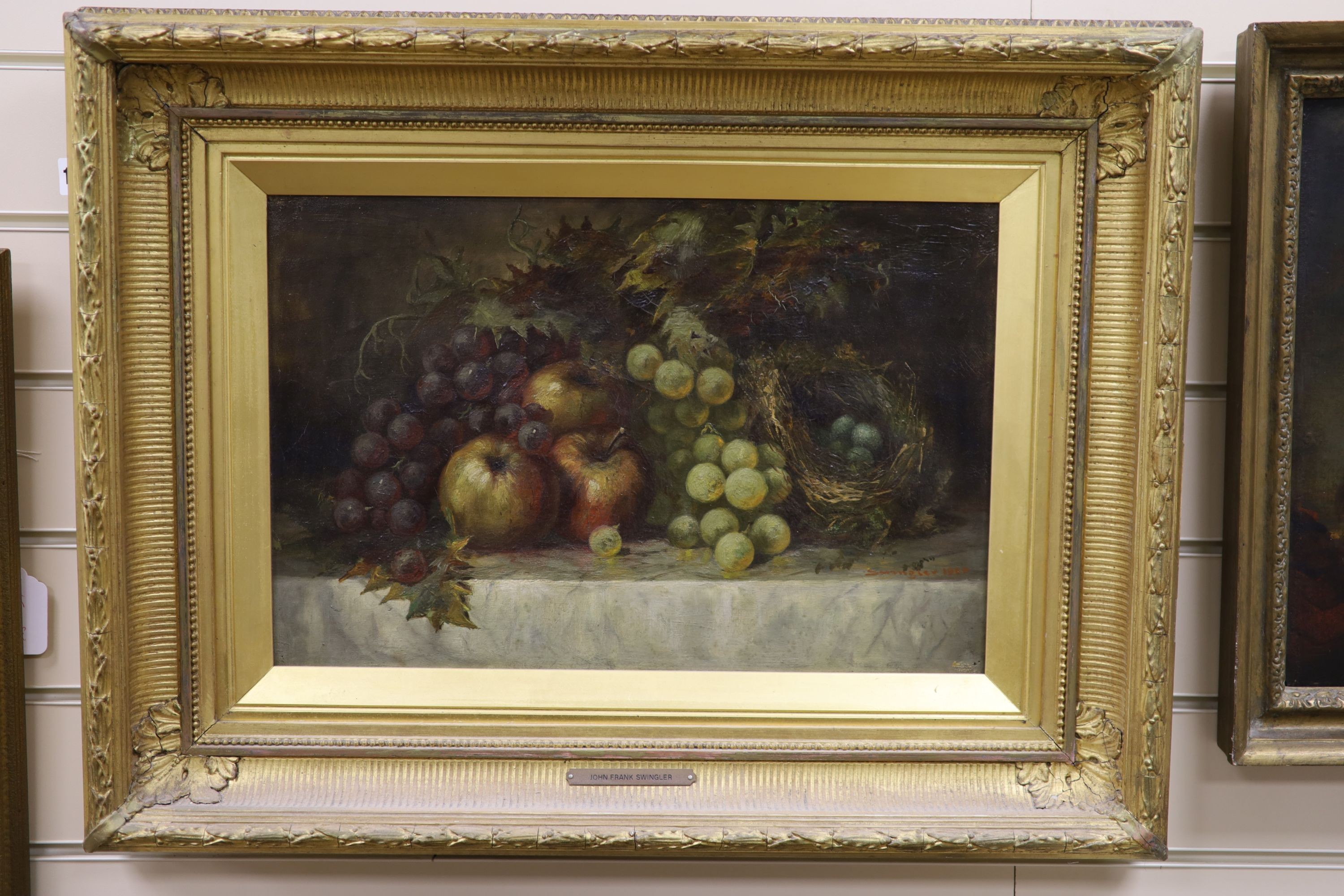 John Frank Swingler (1850-1900), oil on canvas, still life of apples, grapes, and bird's nest, signed, 30 x 45cm.